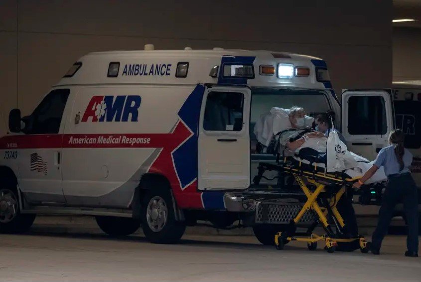 A man on a stretcher is put into an ambulance at the Texas Medical Center in Houston on June 26, 2020.